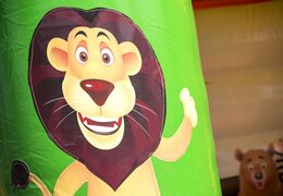 Midi overdekt multifun springkussen met glijbaan bestellen in thema jungle voor kinderen. Springkussens te koop bij JB Inflatables Nederland online