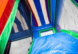 Klein opblaasbare springkussen met glijbaan in unicorn thema kopen voor kinderen. Bestel opblaasbare springkussens online bij JB Inflatables Nederland