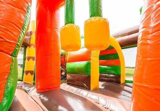 Bestel middelmatig opblaasbare multiplay springkussen in dinoworld thema met glijbaan voor kinderen. Koop opblaasbare springkussens online bij JB Inflatables Nederland