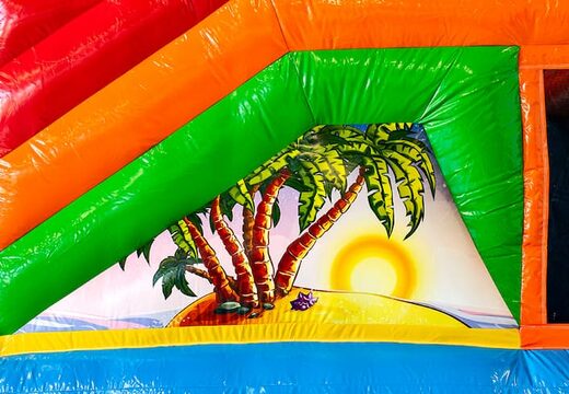 Springkasteel in hawaii theme met een glijbaan bestellen voor kinderen. Koop opblaasbare springkastelen online bij JB Inflatables Nederland