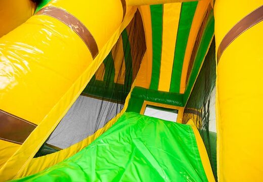 Springkussen in thema jungleworld met een glijbaan kopen voor kinderen. Bestel opblaasbare springkussens online bij JB Inflatables Nederland