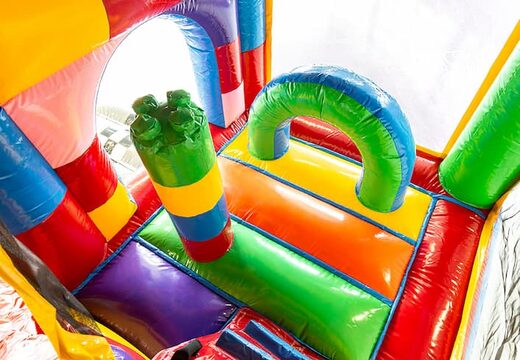 Springkussen in thema superblocks met een glijbaan kopen voor kinderen. Bestel opblaasbare springkussens online bij JB Inflatables Nederland