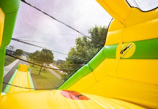 Mega grote opblaasbare monster glijbaan van 46 meter lang in het groen met geel kopen