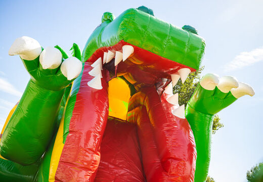 Opblaasbaar luchtkussen multiplay met glijbaan in geel groen dino thema te koop